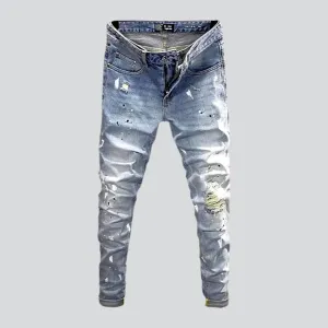 Ripped light men's wash jeans